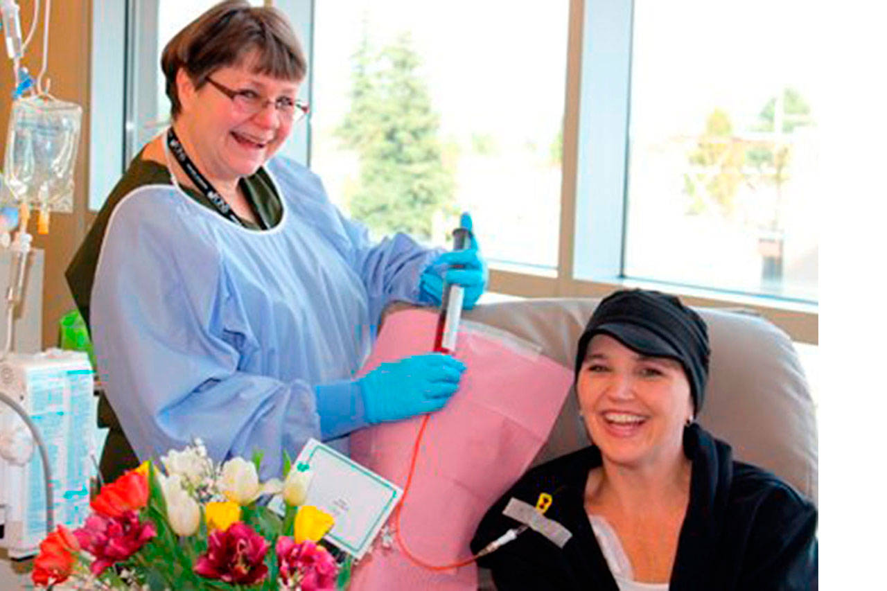 Courtesy Photo                                 Caryn Brown of Arlington manages a smile during chemo treatment.