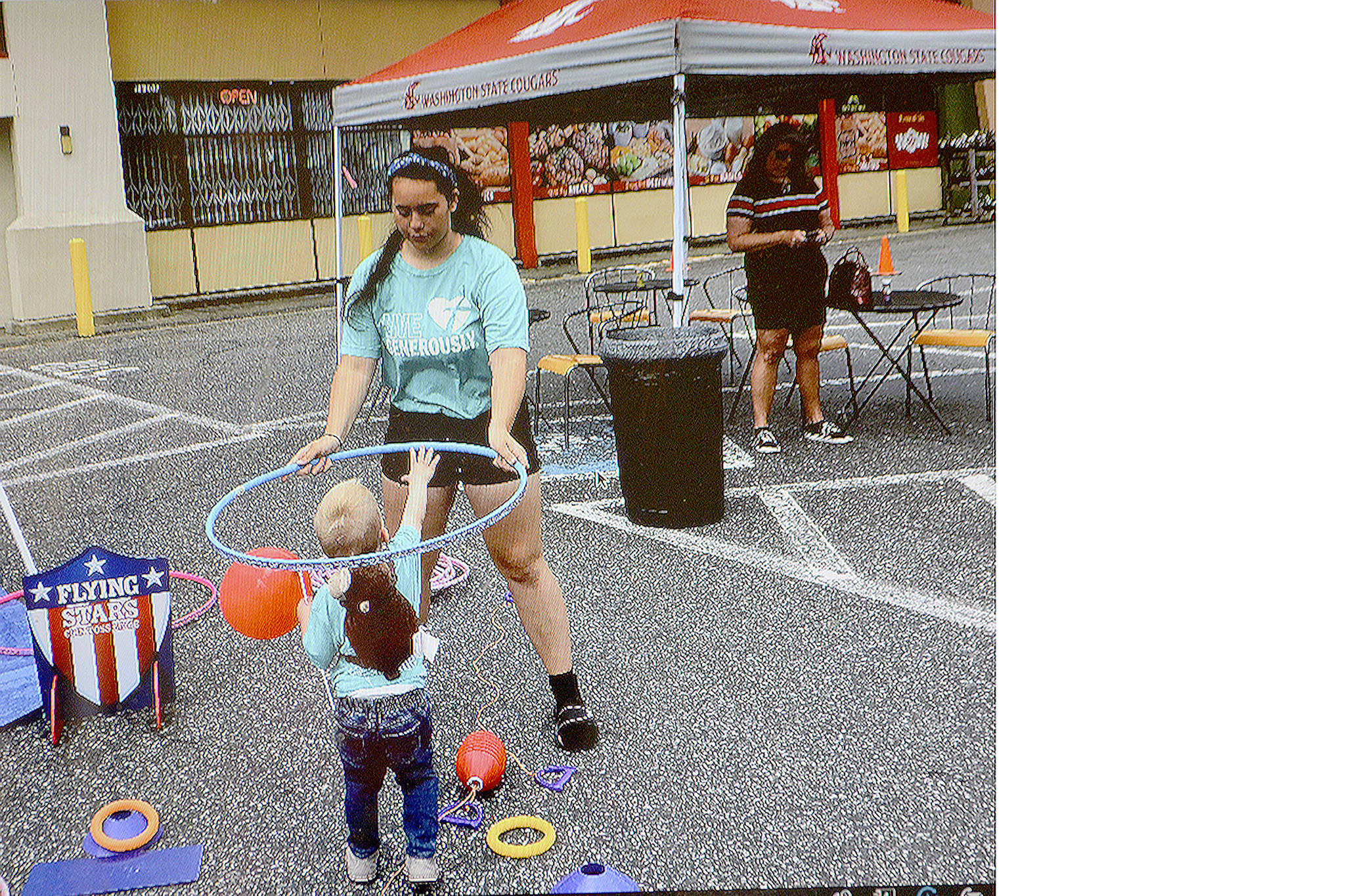 Chloe Braaten plays with her nephew, Matthew, at the Kids Tent at the Marysville Farmers Market on a recent Saturday. (Courtesy Photo)