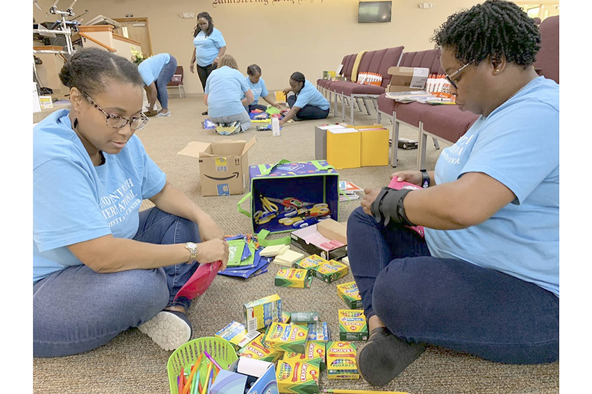 Corlyn Watson and Tequila Coats sort out supplies, helped by Tarra Patrick, Eneille Nelson, Jill Otto, Javonda Parker and Jayla Nelson. (Courtesy Photo)