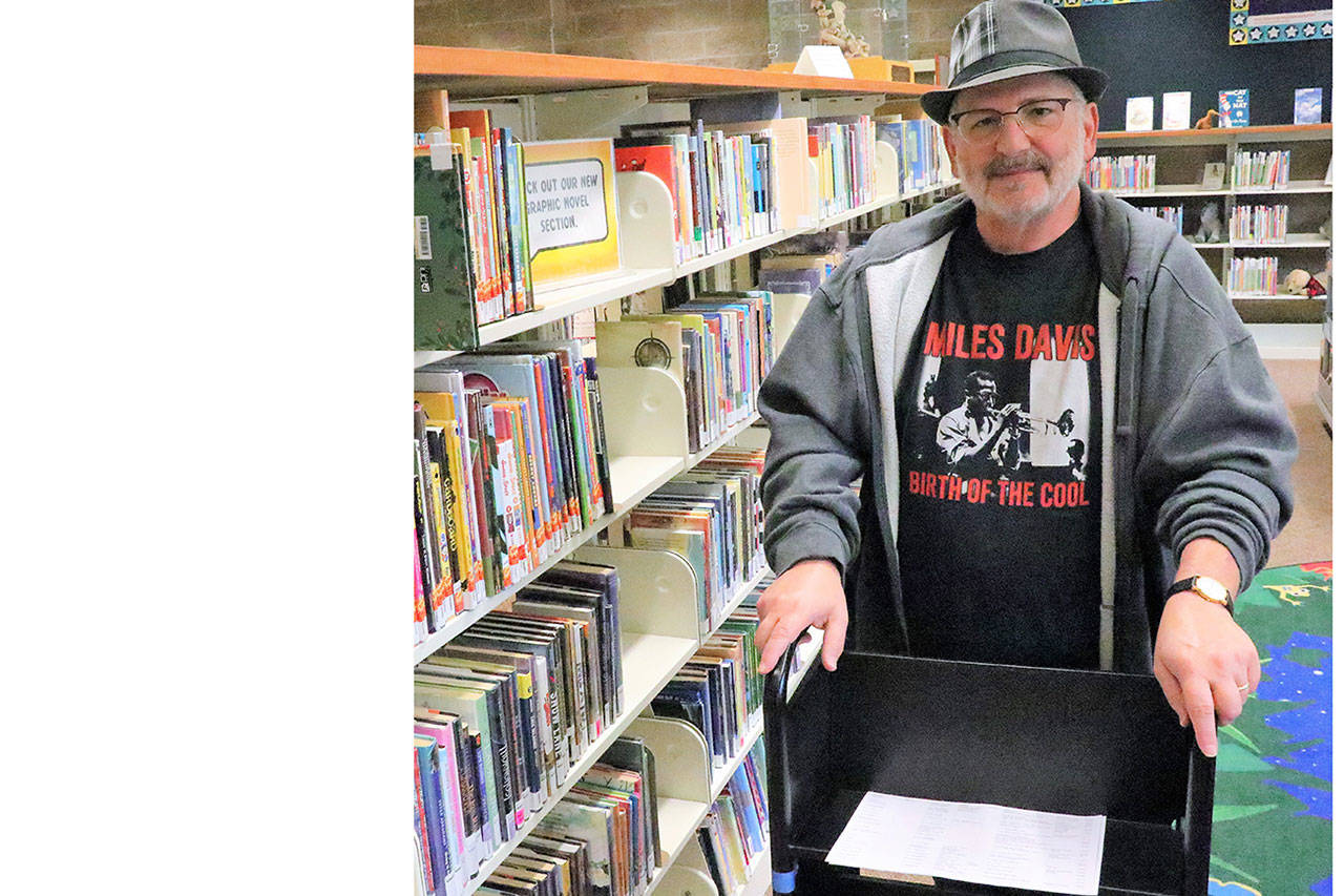 Volunteer enjoys working at Arlington library