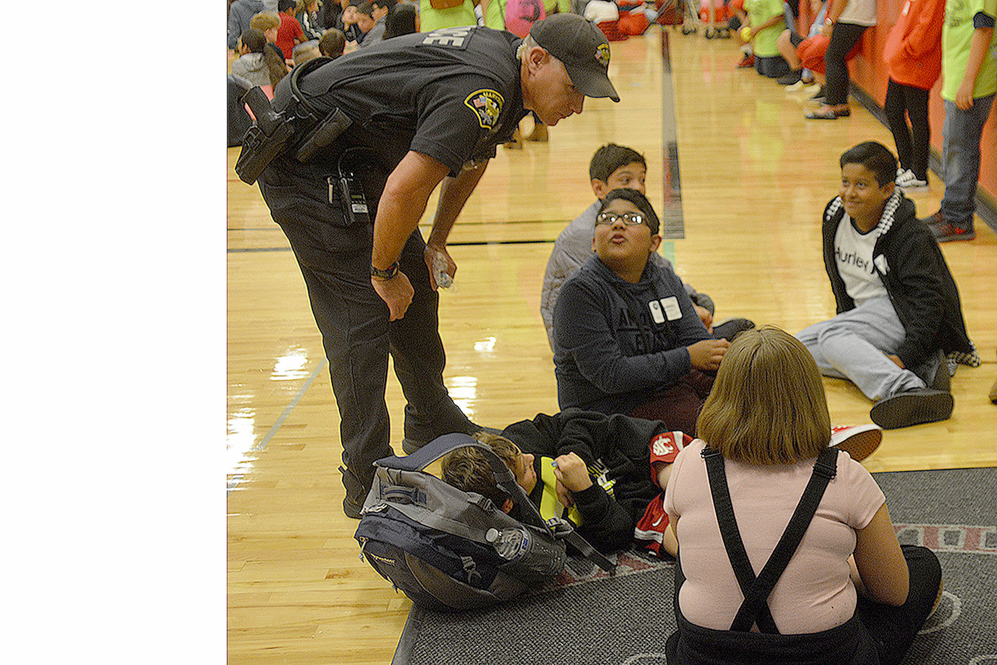 Steve Powell/Staff Photos                                 School Resource Officer Scott Richey talks with kids at a We Belong session.