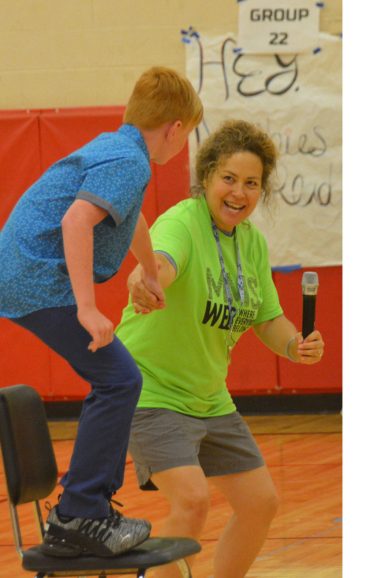 We Belong teacher Dana Wojcik shows a student how hard it is to pick someone up.