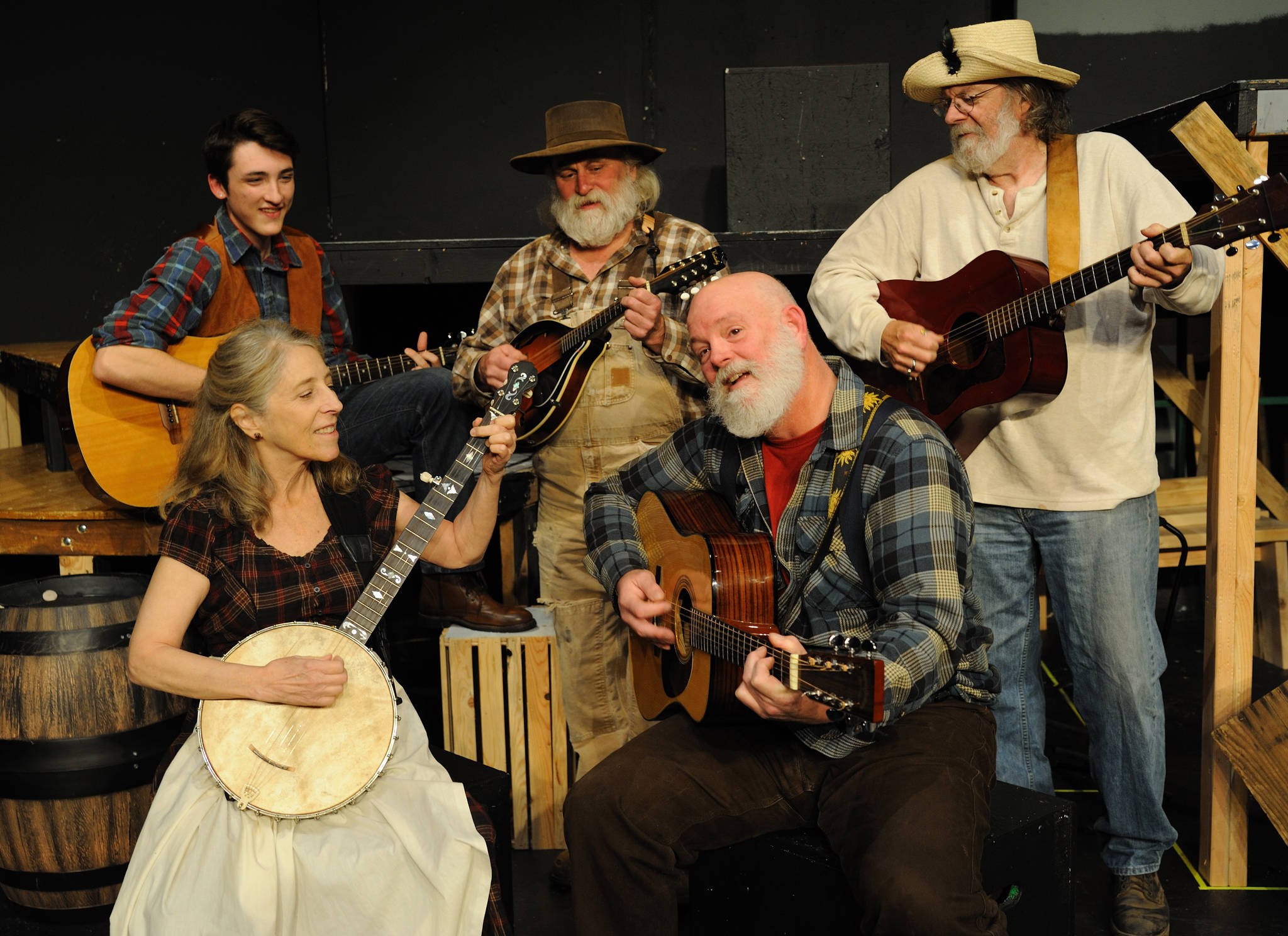 The actors/musicians who provide the musical backdrop for “Dark of the Moon” Drew Winston, left, Dyann Arthur, James Prater, Bill Pfleging, and Joe Goins.