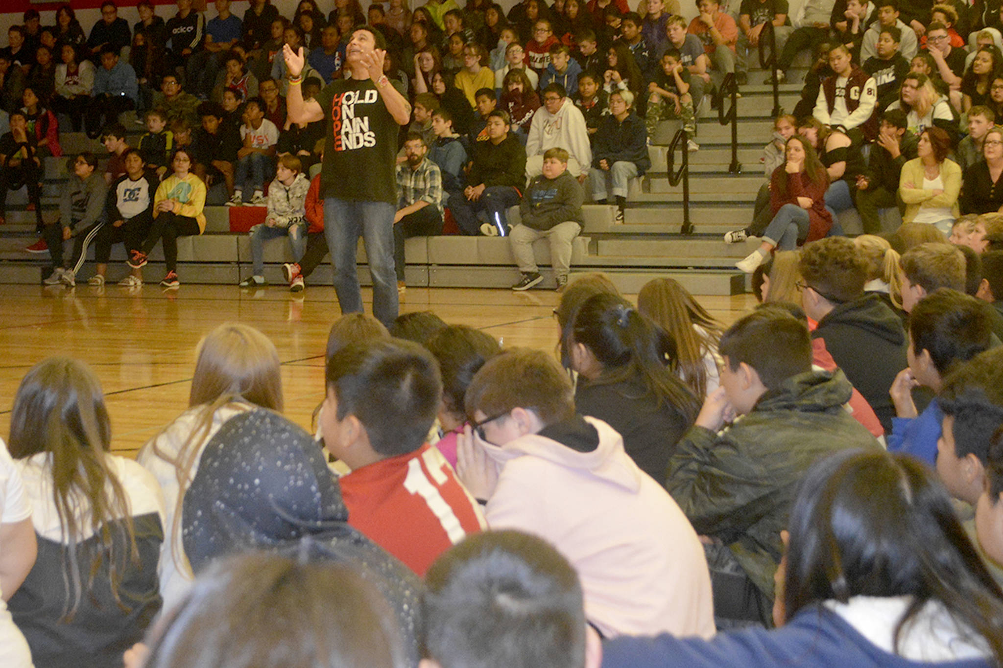 Surrounded by Marysville Middle School students, Marc Mero tells how he told his mom he was sorry after she died. (Steve Powell/Staff Photo)