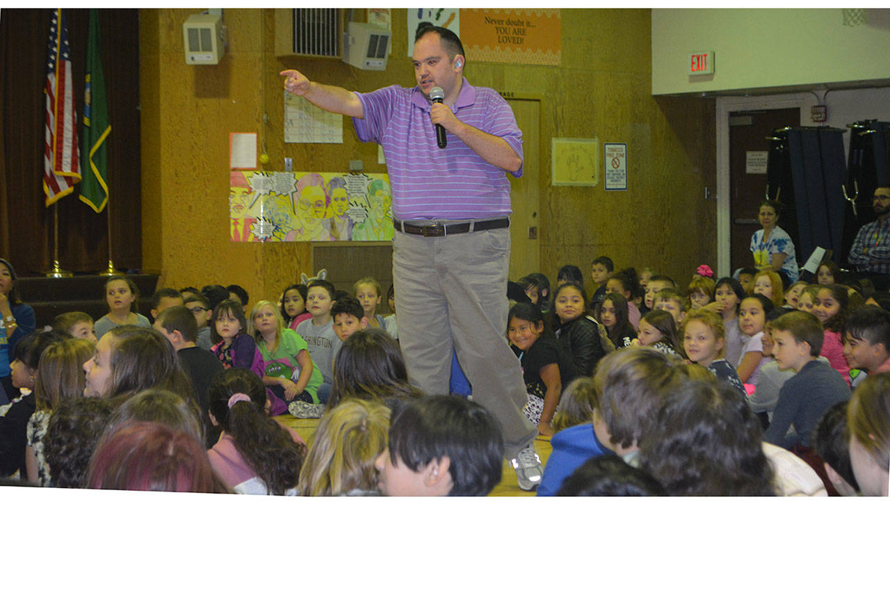 Preston Dwoskin talks to Cascade Elementary students about finding a superhero to stop the bullying. (Steve Powell/Staff Photos)