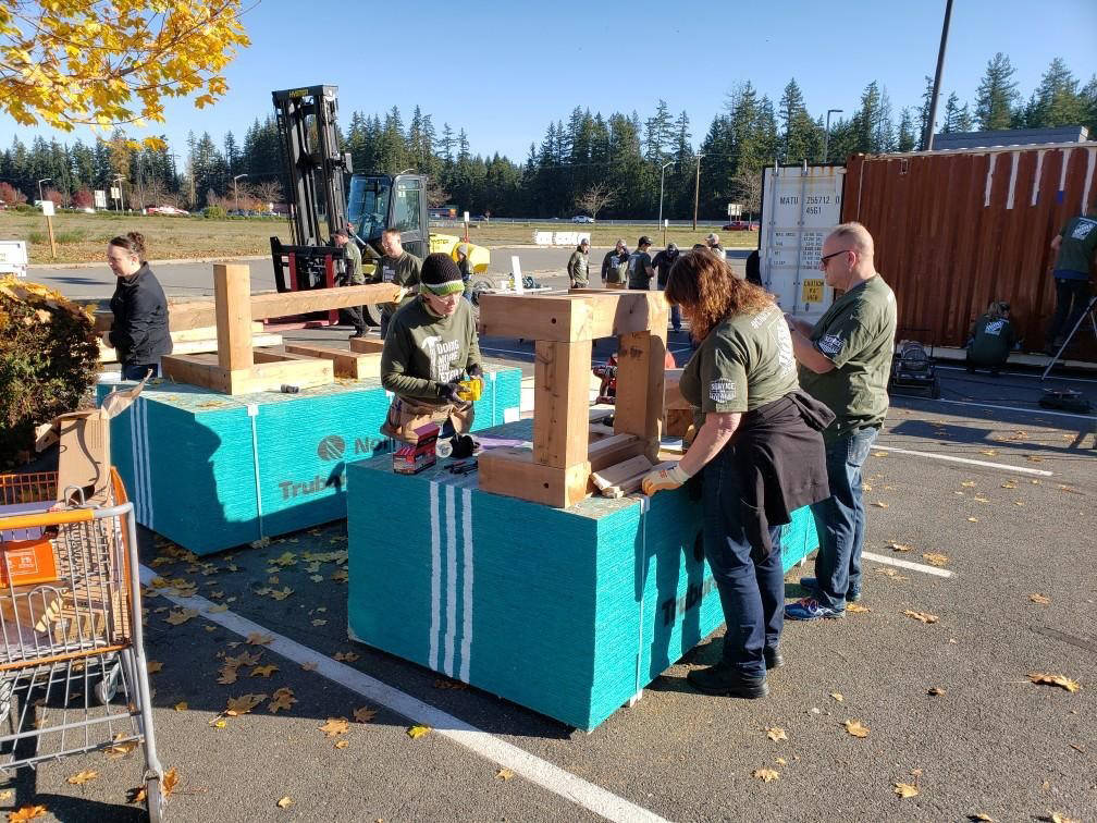 Courtesy Photo                                 Workers at The Home Depot in Tulalip volunteered to build a tiny house for a Marysville-area disabled veteran and father with special needs children.