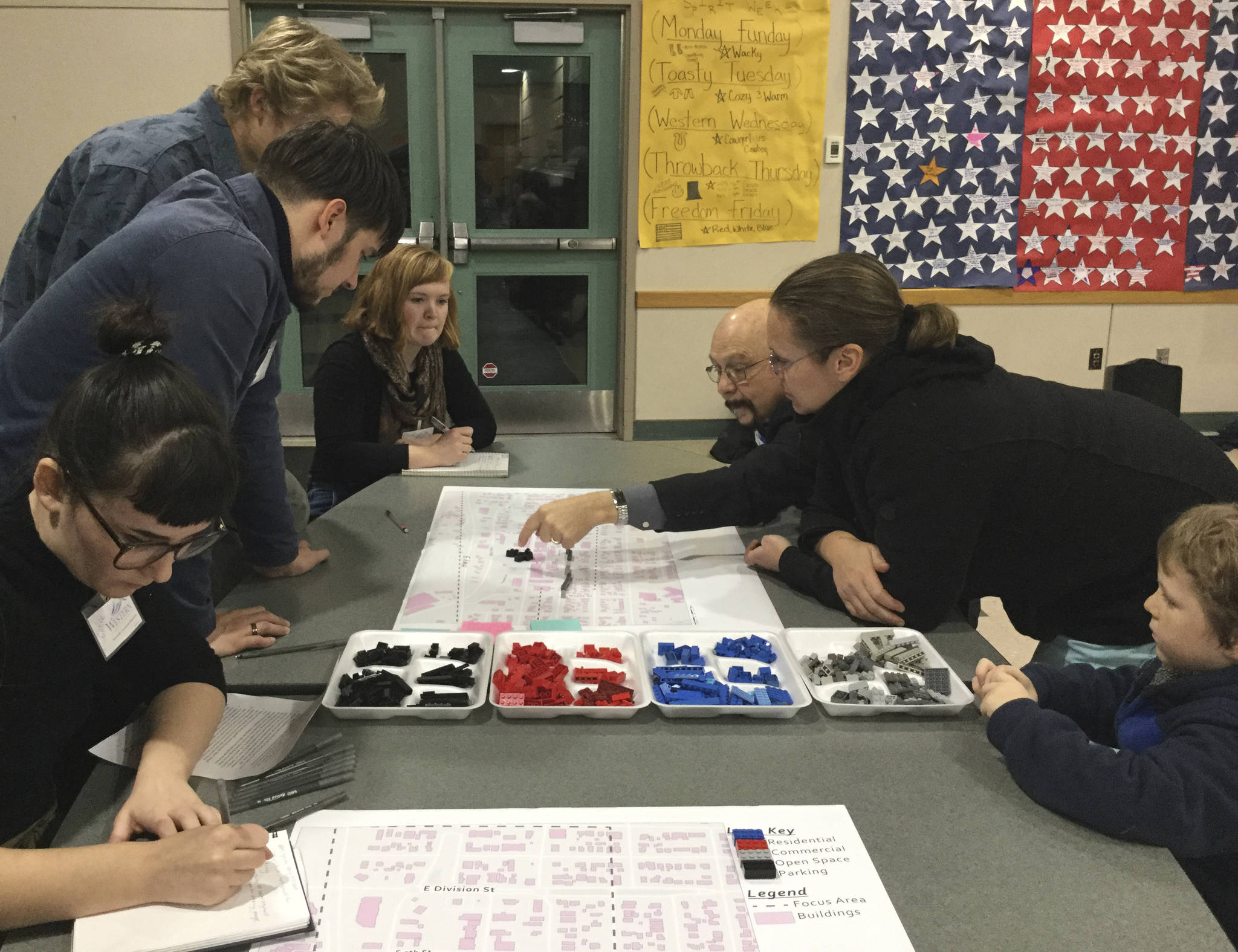 Arlington City Councilman Mike Hopson, residents and WWU students join an exercise using a downtown map and color-coded Legos to represent where they would focus different types of housing, businesses and mixed uses.