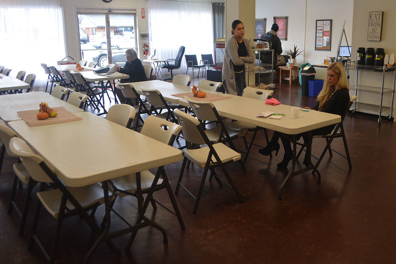 Steve Powell/Staff Photo                                 The tables for meals are taken down so this new Salvation Army space on State can be used as a cold-weather shelter. Their only employee, Jenny Roodzant, right, with the help of volunteers, are still providing for Marysville’s needy.