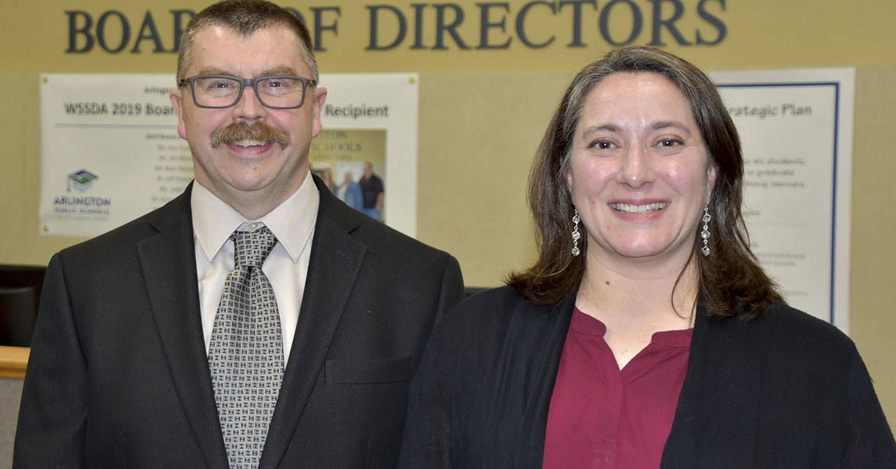 New Arlington school board members Michael Ray and Mary Leveque.