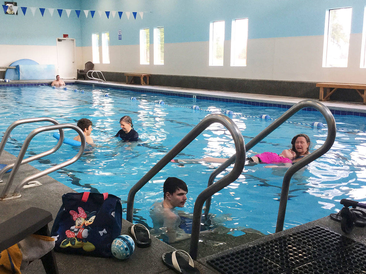 Arlington instructor Cheryl Burkhead helps student Rhyann Morgan float in the Stillaguamish Athletic Club pool as an activity new to the school district’s 18-21 transition program.