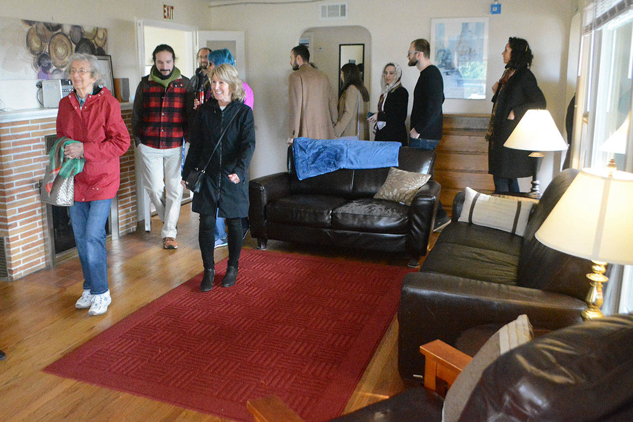 Folks check out the Miracle House for homeless families. (Steve Powell/Staff Photo)