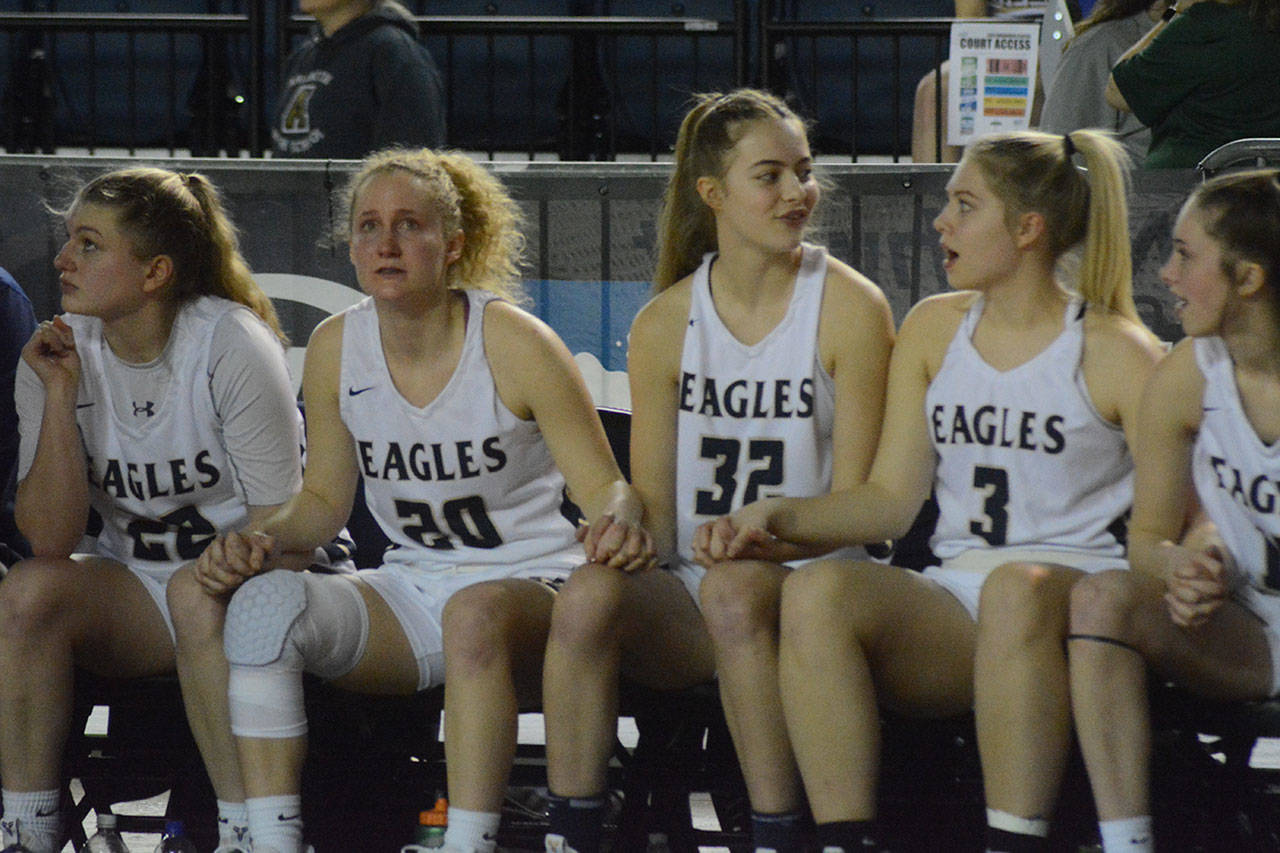 The girls on the bench show a range of emotions at the clock winds down. (Steve Powell/Staff Photos)