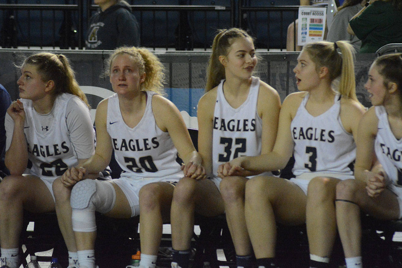 The girls on the bench show a range of emotions at the clock winds down. (Steve Powell/Staff Photos)