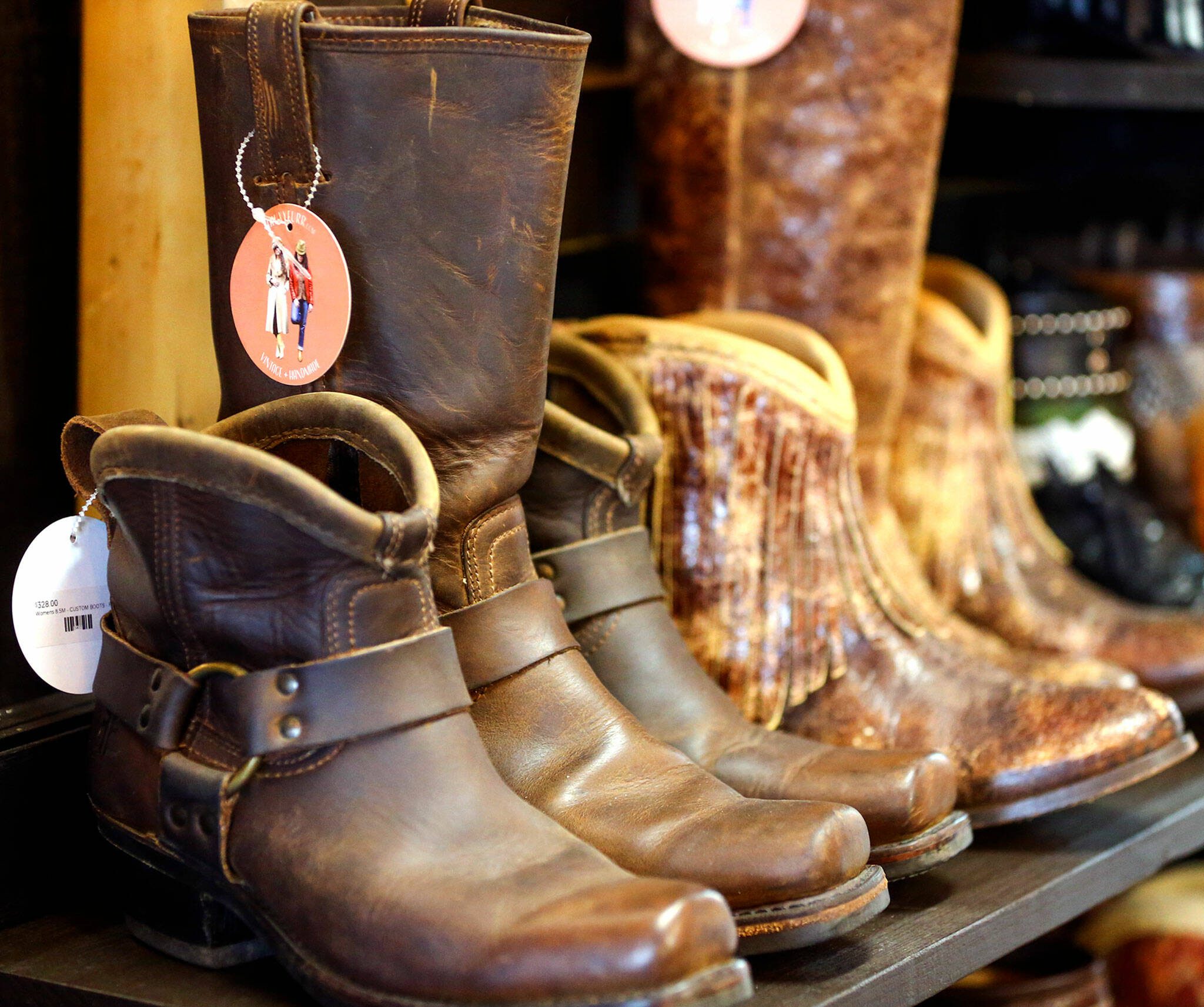 FauxyFurr in Arlington up-cycles boots, adding custom trim. (Kevin Clark / The Herald)