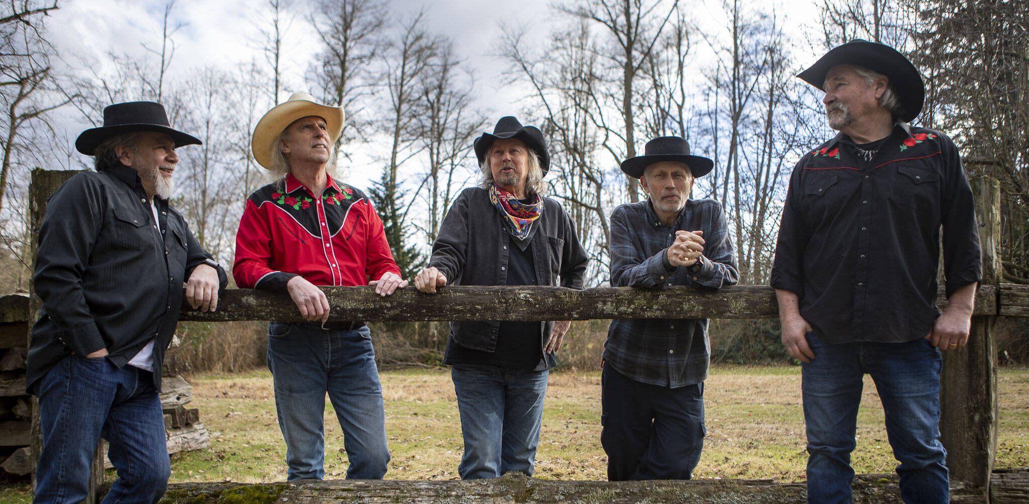 Left to right, Lonnie Mueller, Jim Kehoe, Dennis Coile also known as “Dan Canyon,” Paul Buchignani and Pete Frothingham pose for a photo during a Dan Canyon Band rehearsal at their practice barn in Arlington, Washington on Saturday, March 11, 2023. (Annie Barker / The Herald)