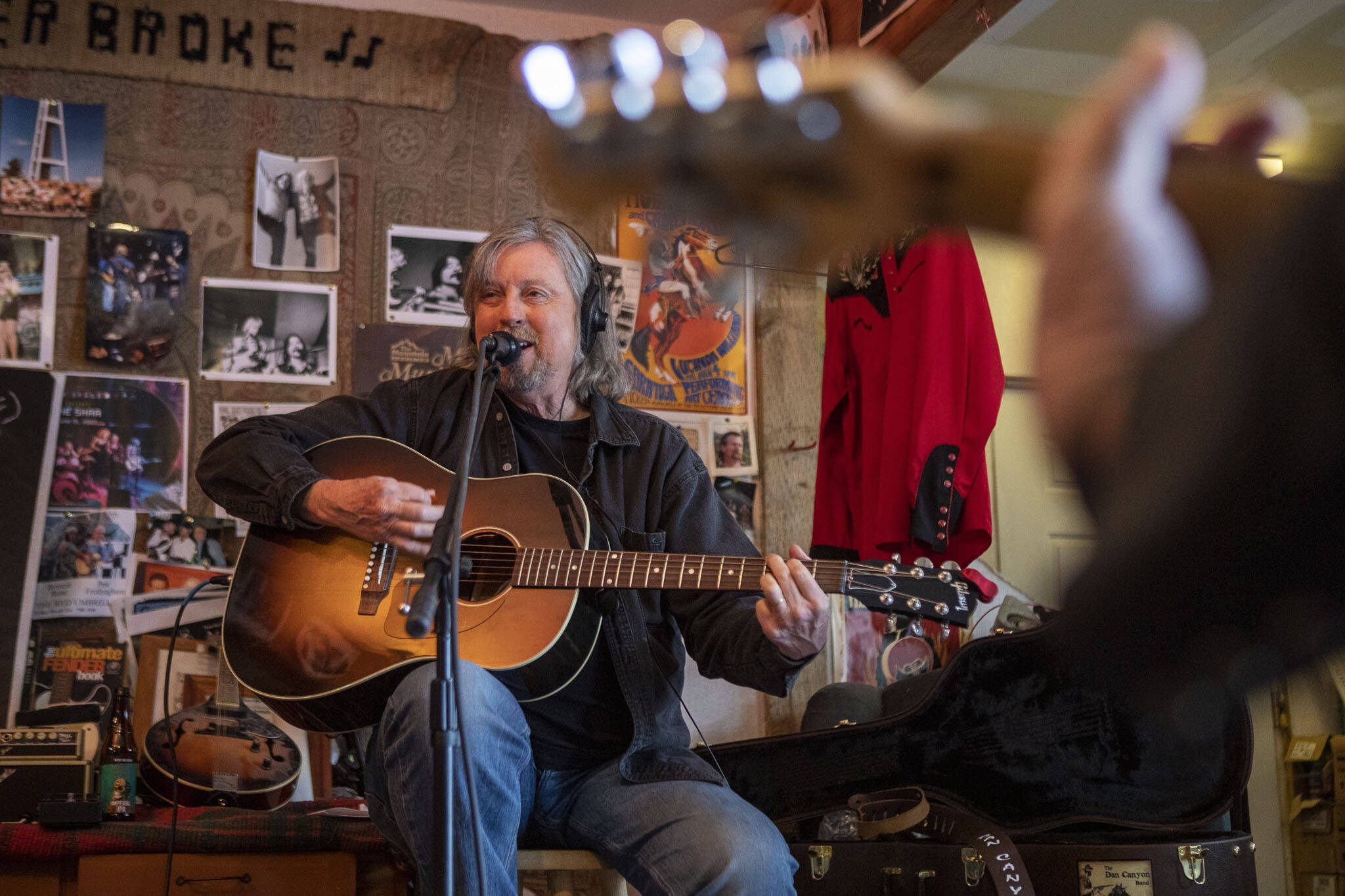 Dennis Coile also known as “Dan Canyon” sings and plays guitar during a Dan Canyon Band rehearsal in the group’s practice barn in Arlington, Washington, on Saturday, March 11, 2023. (Annie Barker / The Herald)