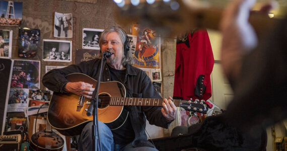 Dennis Coile also known as “Dan Canyon” sings and plays guitar during a Dan Canyon Band rehearsal in the group's practice barn in Arlington, Washington, on Saturday, March 11, 2023. (Annie Barker / The Herald)