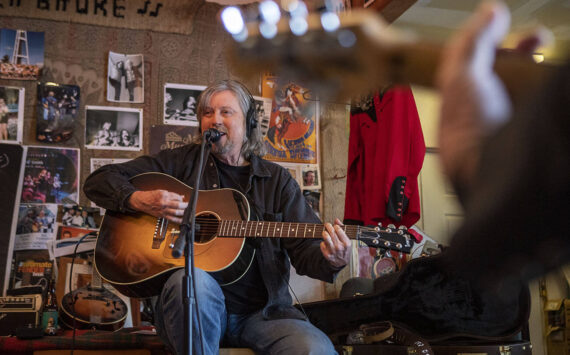 Dennis Coile also known as “Dan Canyon” sings and plays guitar during a Dan Canyon Band rehearsal in the group's practice barn in Arlington, Washington, on Saturday, March 11, 2023. (Annie Barker / The Herald)