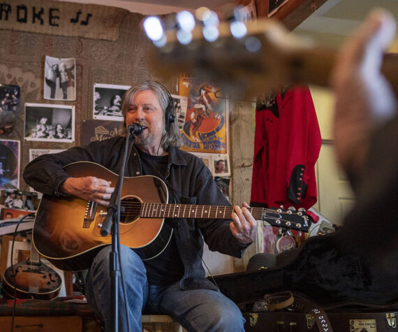 Dennis Coile also known as “Dan Canyon” sings and plays guitar during a Dan Canyon Band rehearsal in the group's practice barn in Arlington, Washington, on Saturday, March 11, 2023. (Annie Barker / The Herald)